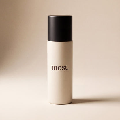 A bottle of most. AnchorSet Spray with its matte black cap