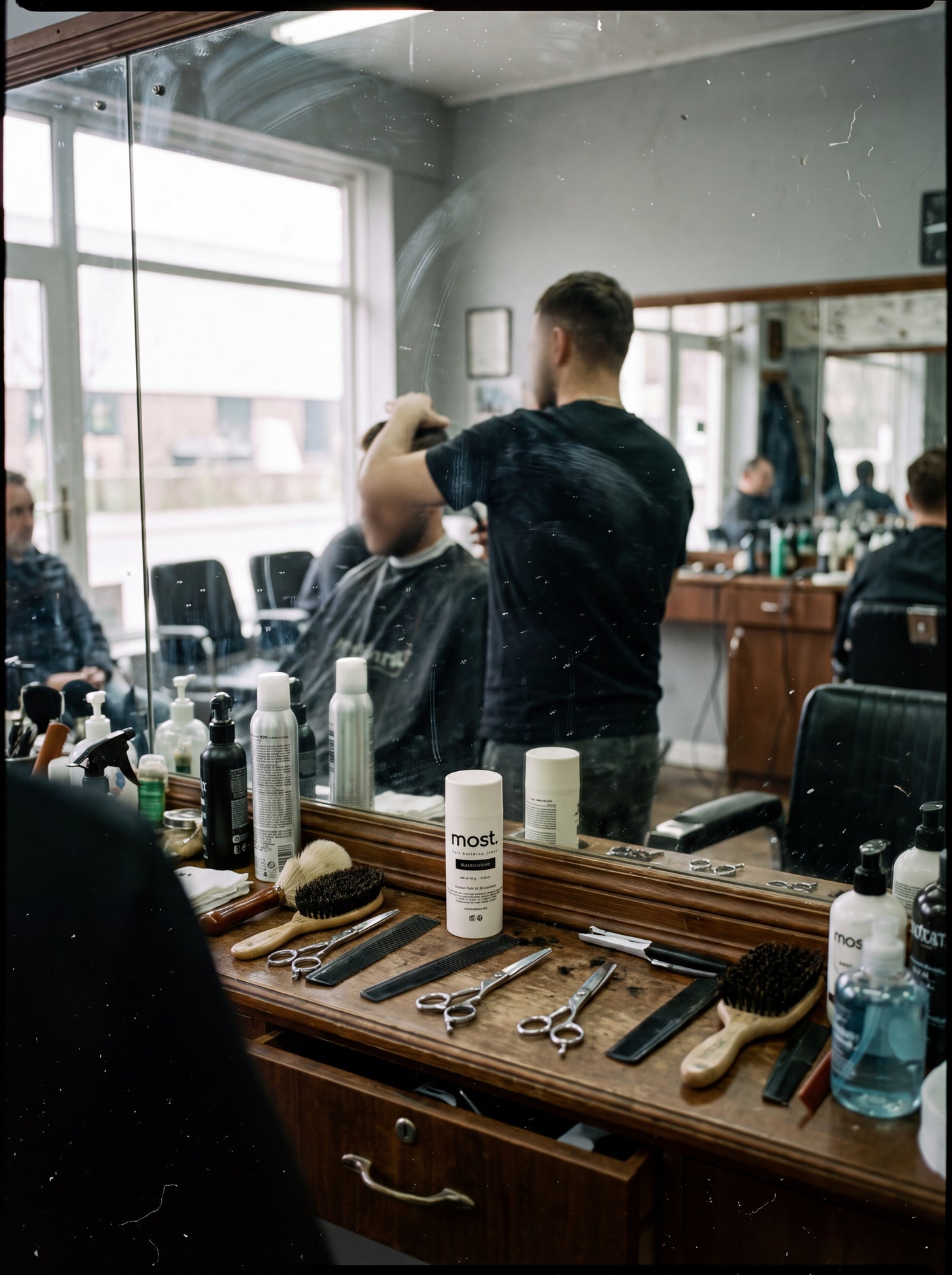 Barber applying most. fibers